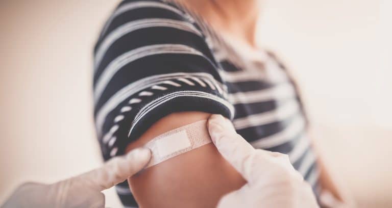 Woman and a doctor in the hospital after vaccination against Covid 19. Concept immunization and making injections from pandemic of SARS.